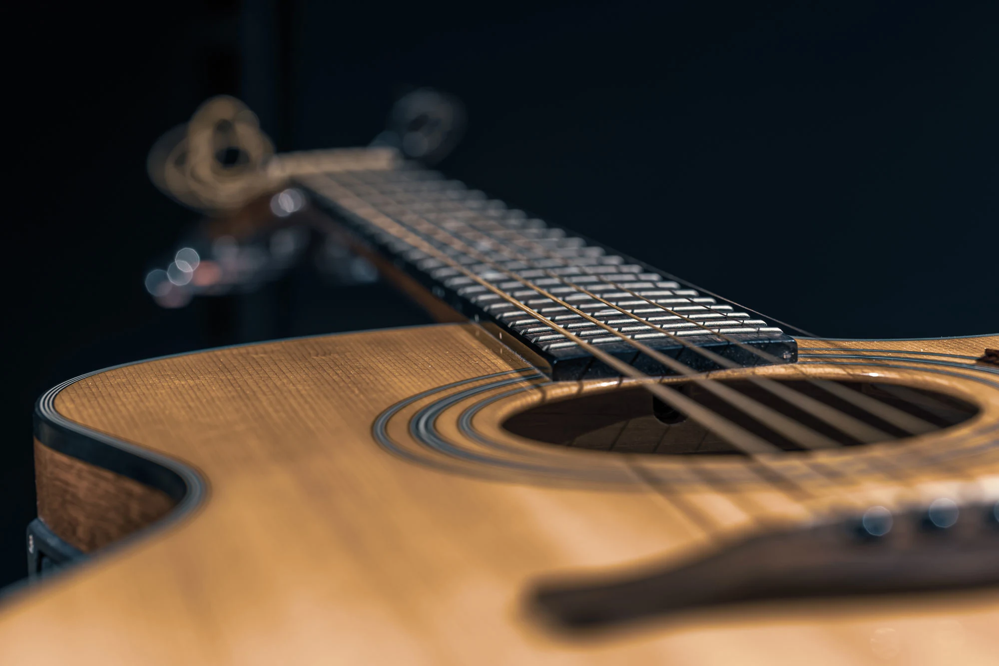 Close Up Of An Acoustic Guitar On A Dark Backgroun 2026 01 09 08 12 01 Utc2 1